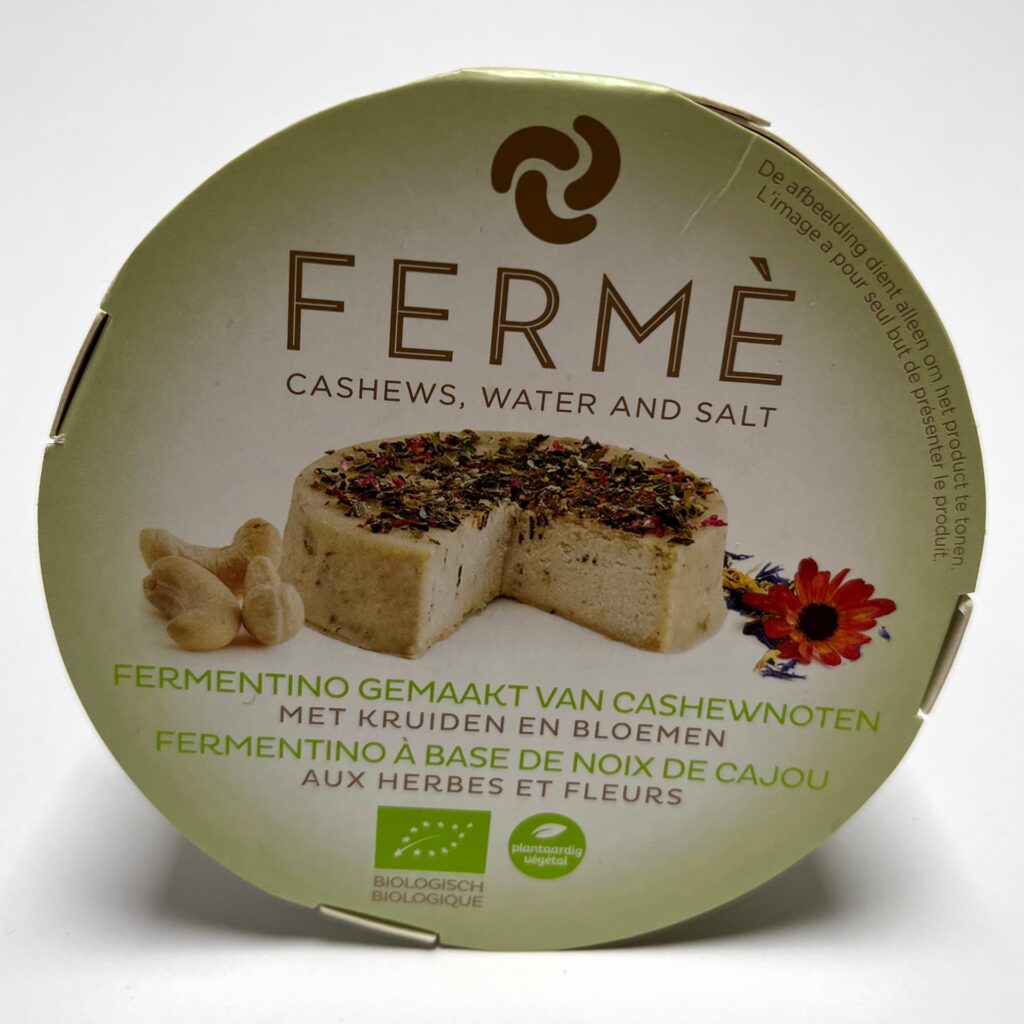 Front of packaging of Ferme Herbs & Flowers vegan cheese by Casa del Fermentino