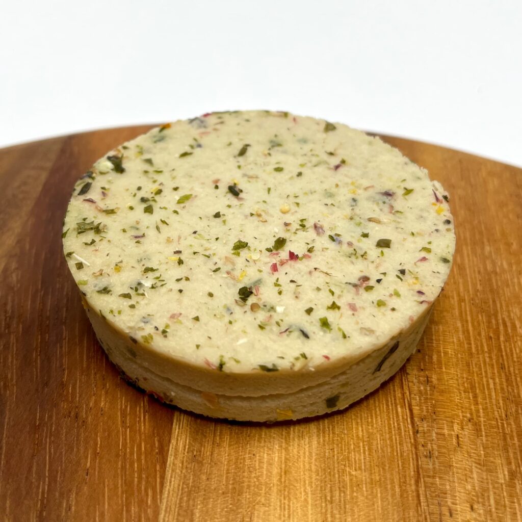 Top view of Ferme Herbs & Flowers vegan cheese by Casa del Fermentino