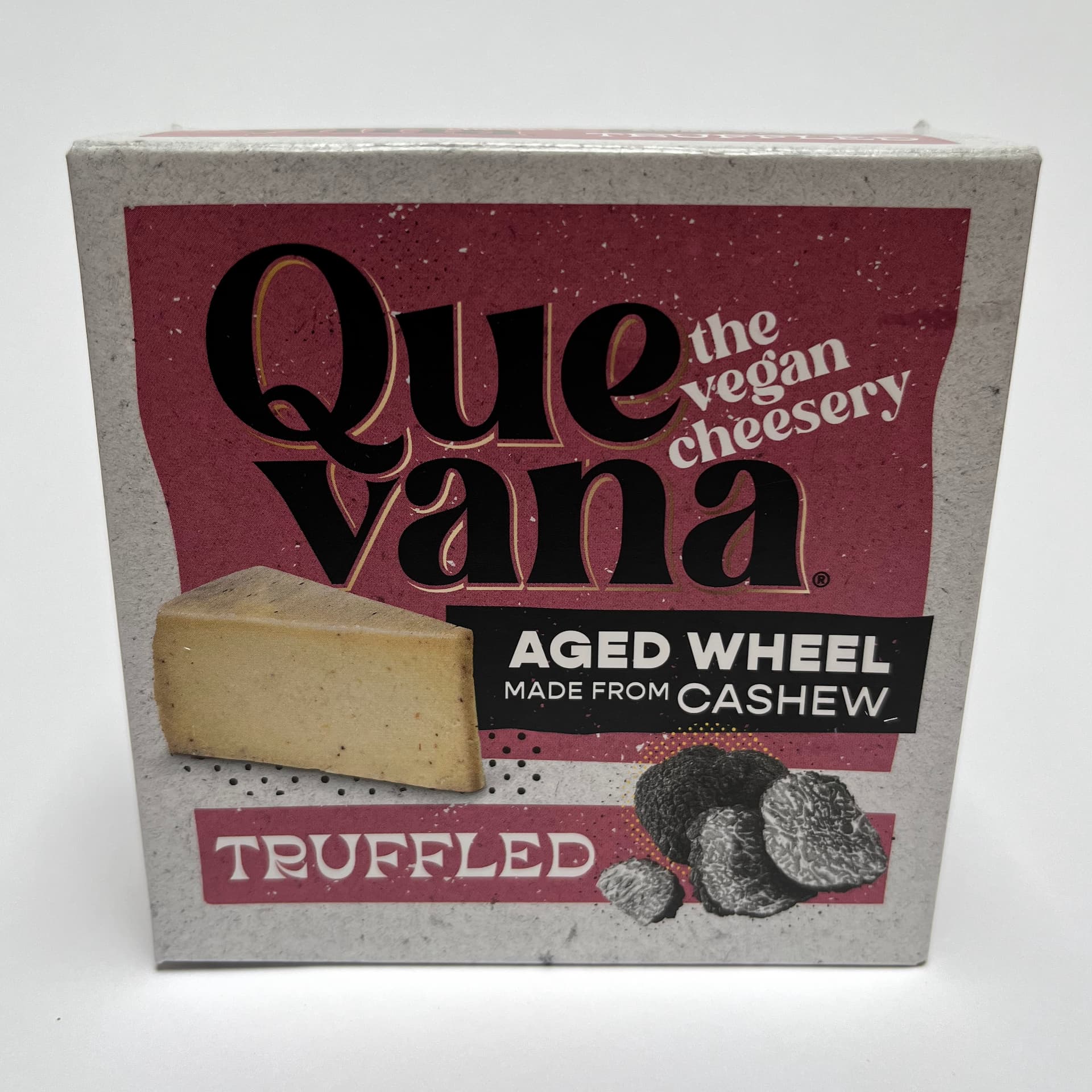 Front of packaging of Truffled aged wheel vegan cheese by Quevana