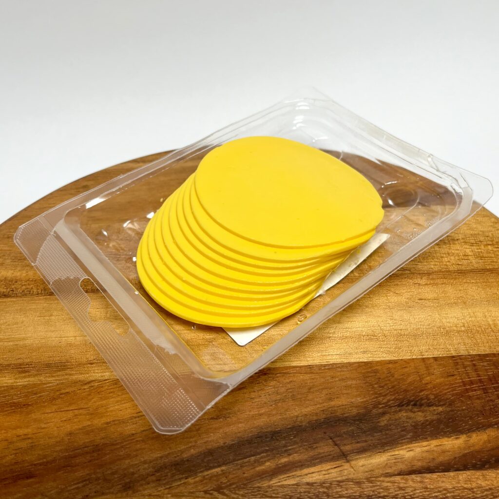 Opened packaging of Intense slices vegan cheese by Vegan Deli