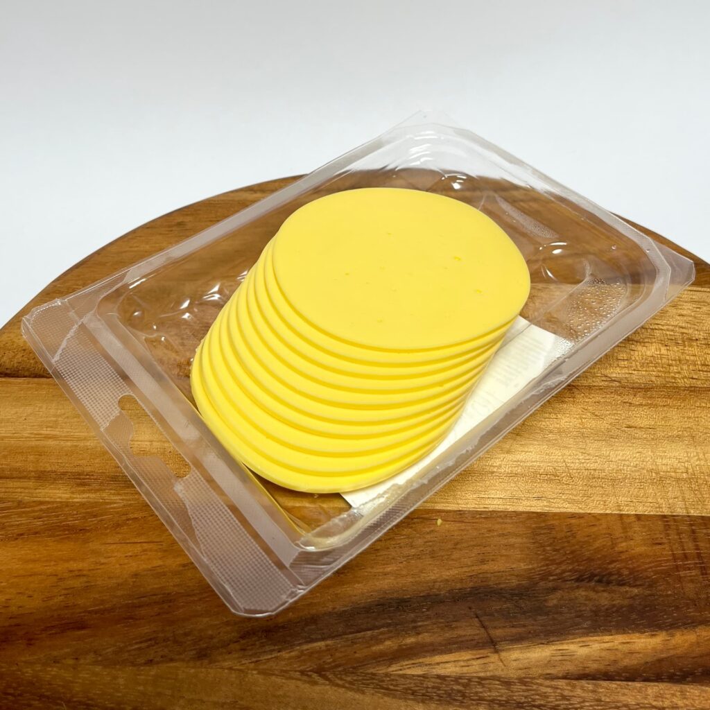 Opened packaging of Original Slices vegan cheese by Vegan Deli