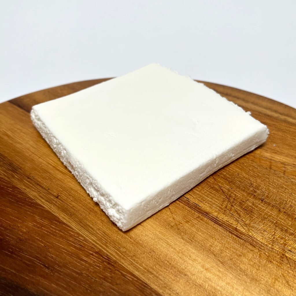 Top view of Plant-based White Slice vegan cheese by AH Terra