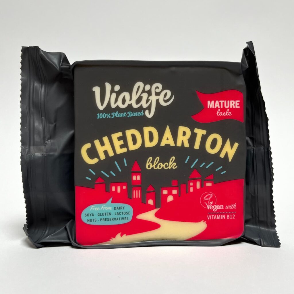 Front of packaging of Cheddarton vegan cheeese by Violife